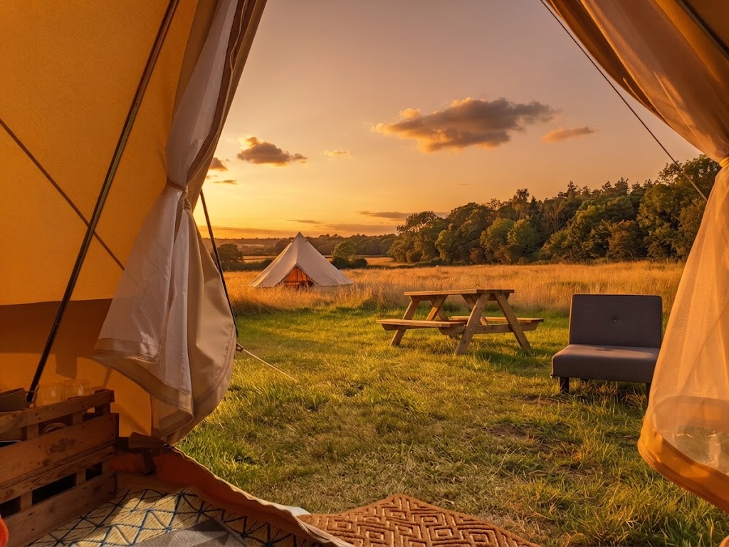 Yurt pitched on Anglesey with the sea and Snowdonia visible beyond