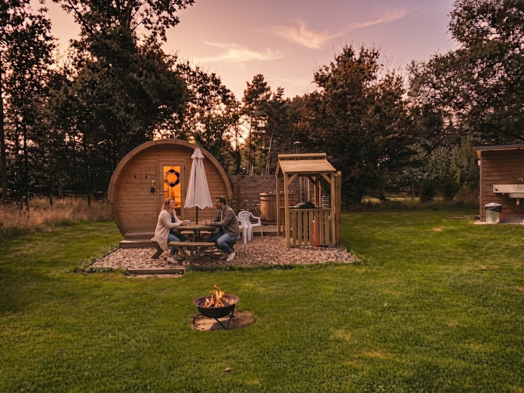 Glamping pod with private hot tub on decking in the Welsh countryside