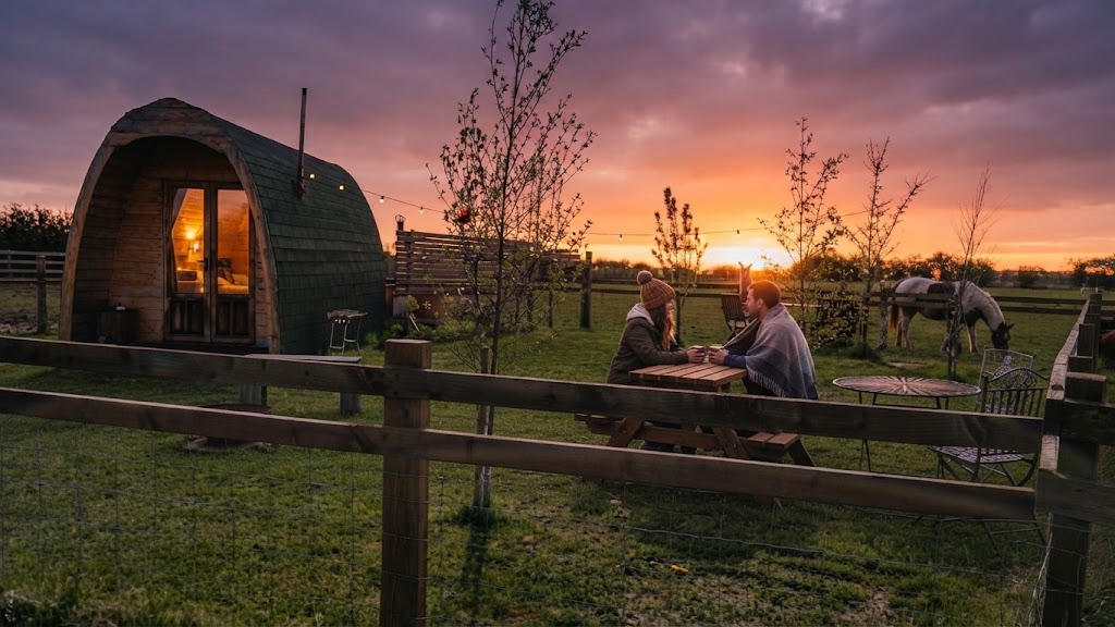 Glamping safari tent overlooking a Welsh valley at sunrise