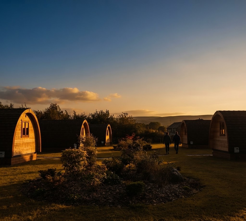 Yurt lit from inside at night with stars overhead in mid Wales